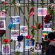 People look at a memorial for the victims of an apartment building fire near the site of the fire in the Bronx borough of New York.